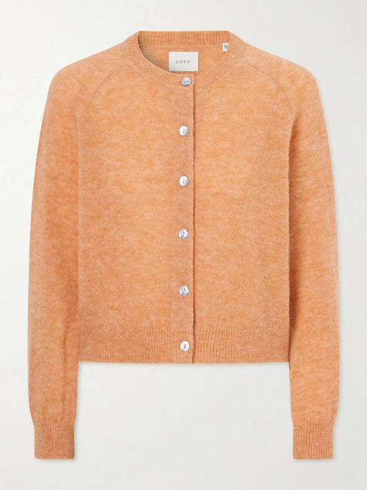 Image of a model wearing Outerwear. Product name - Petra Alpaca Cardigan in Coral colour by brand - DÔEN