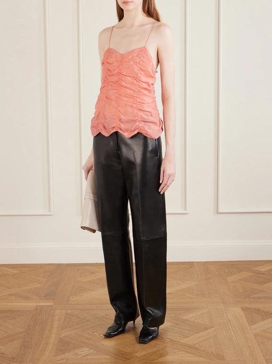 Image of a model wearing Tops. Product name - Inara Draped Silk-blend Top in Coral colour by brand - KHAITE