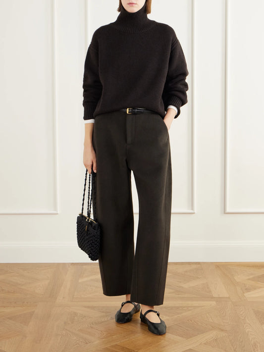 Image of a model wearing Outerwear. Product name - Tiona Open-back Cashmere Turtleneck Sweater in Brown colour by brand - LISA YANG