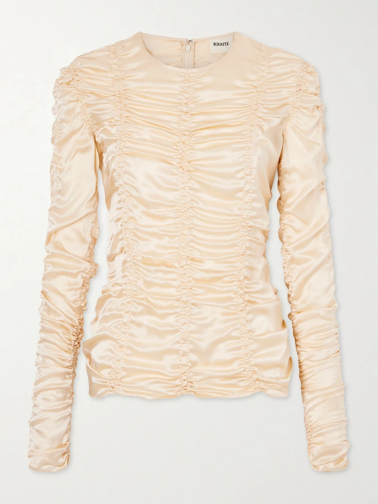 Image of a model wearing Tops. Product name - Rory Ruched Silk Top in Ecru colour by brand - KHAITE