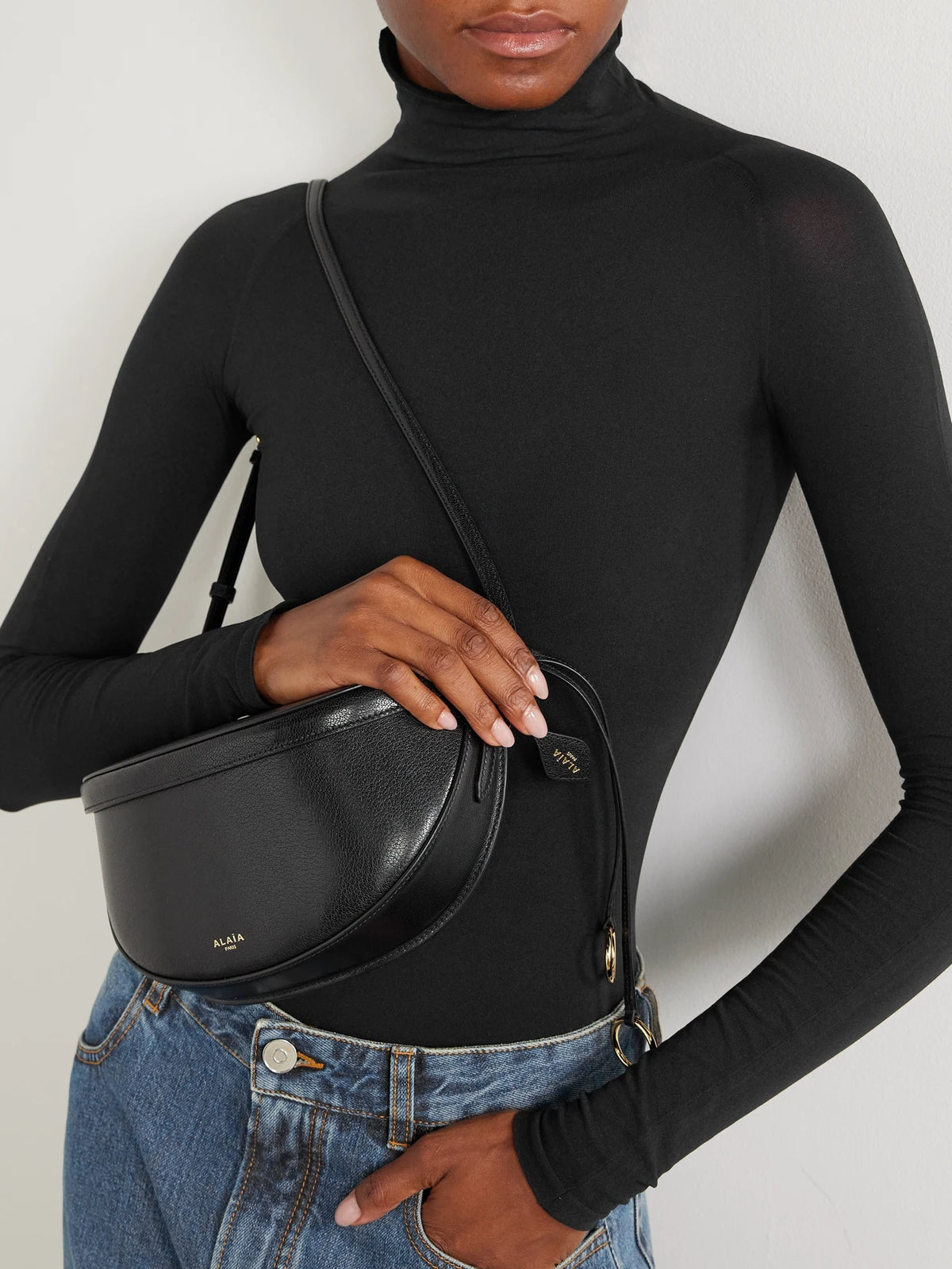 Image of Bags. Product name - Molded East West Leather Shoulder Bag in Black colour by brand - Alaïa