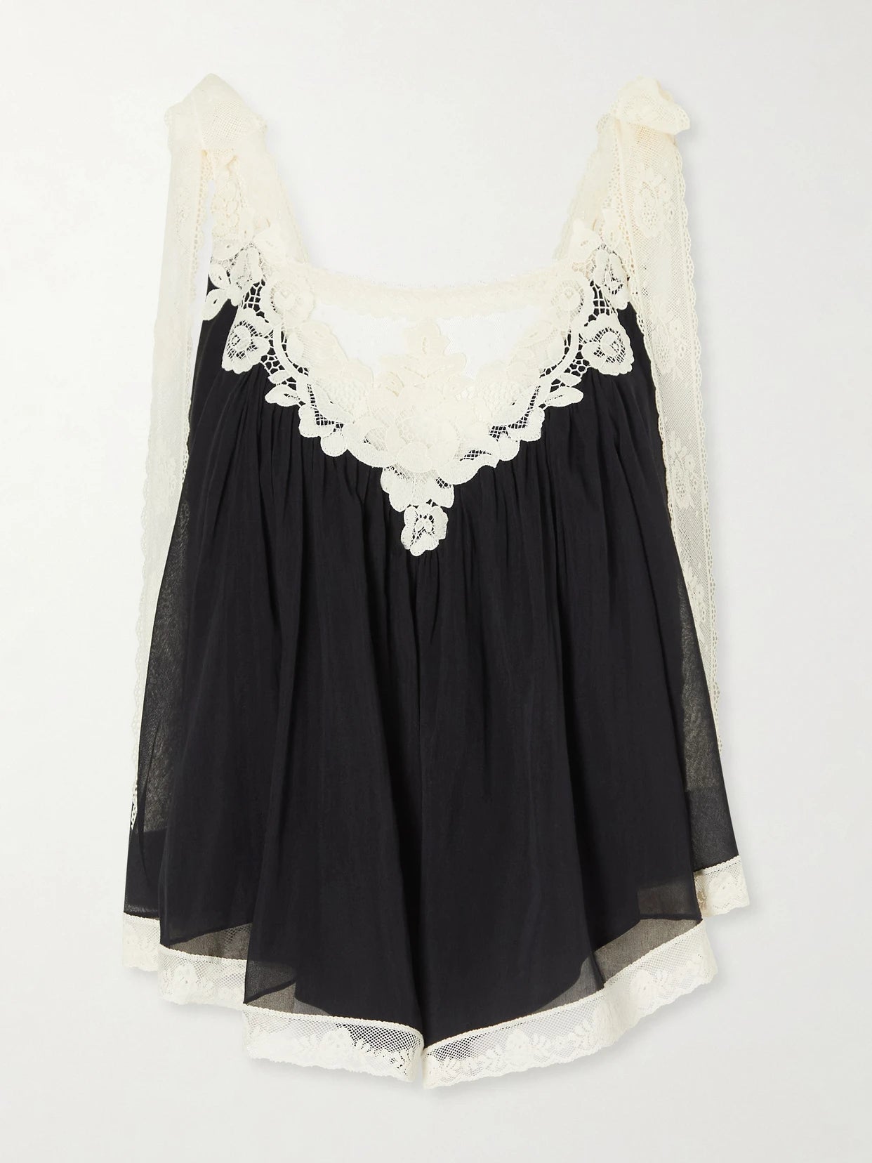 Image of a model wearing Tops. Product name - Roselight Lace-trimmed Cotton And Silk-blend Cami Top in Black colour by brand - Zimmermann