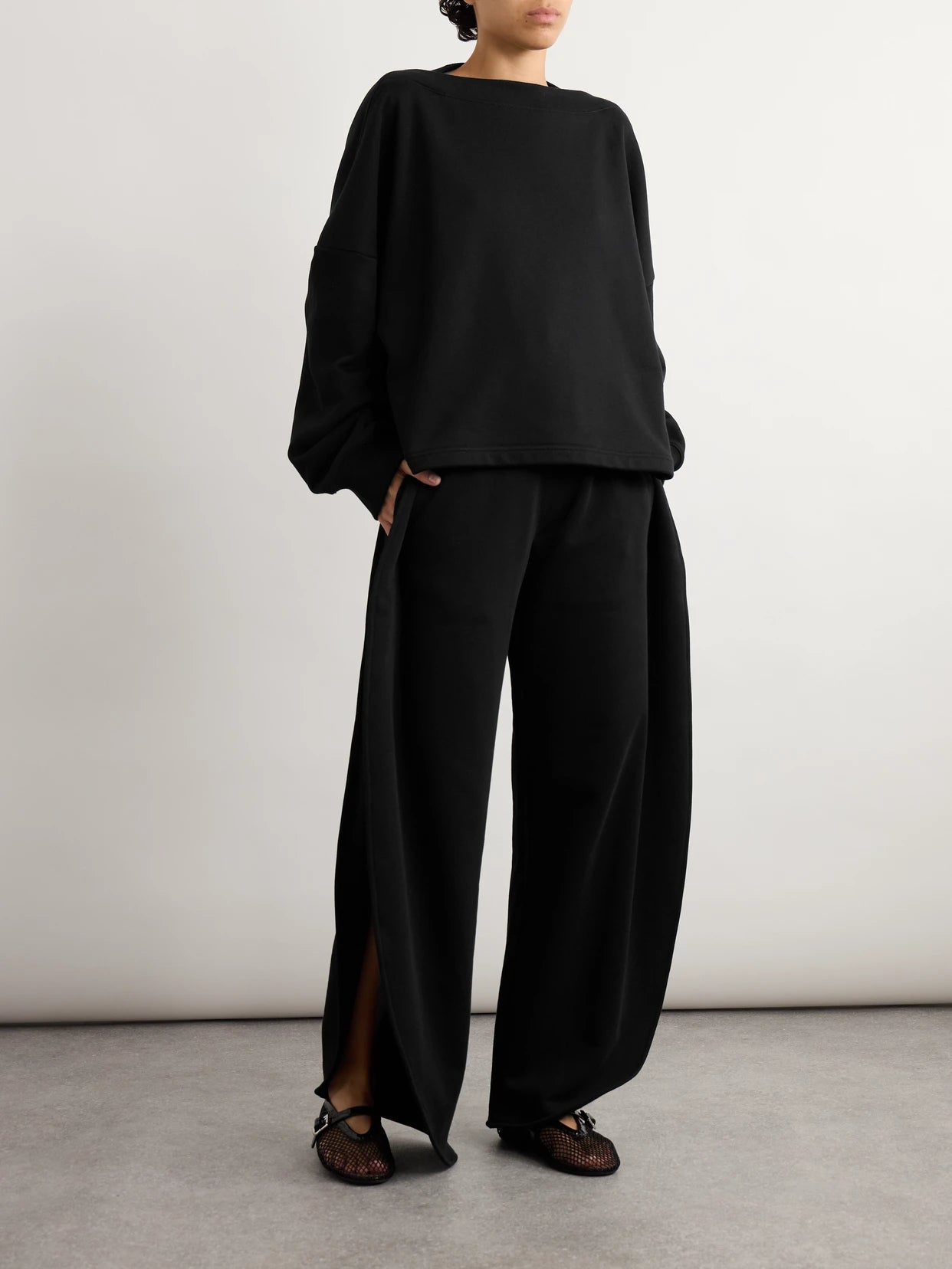 Image of Sleepwear & Loungewear. Product name - Oversized Cotton-jersey Sweatshirt in Black colour by brand - Alaïa