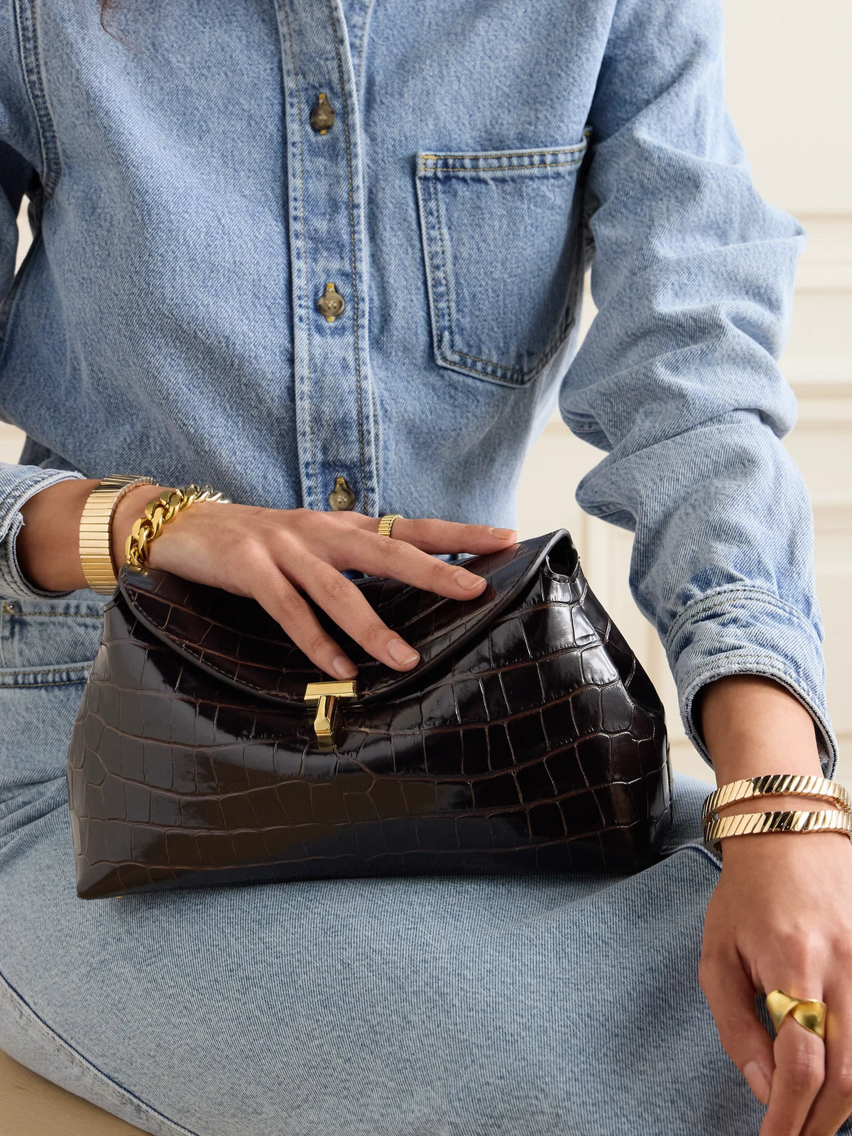 Image of Bags. Product name - T-lock Croc-effect Leather Clutch in Dark brown colour by brand - TOTEME