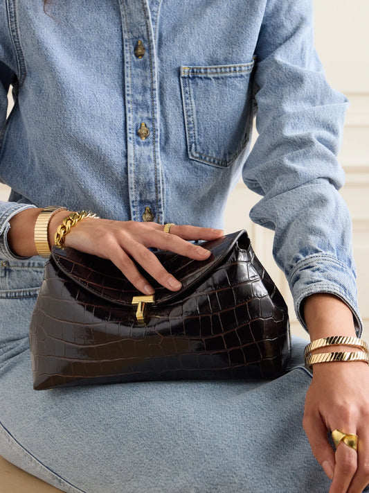 Image of Bags. Product name - T-lock Croc-effect Leather Clutch in Dark brown colour by brand - TOTEME