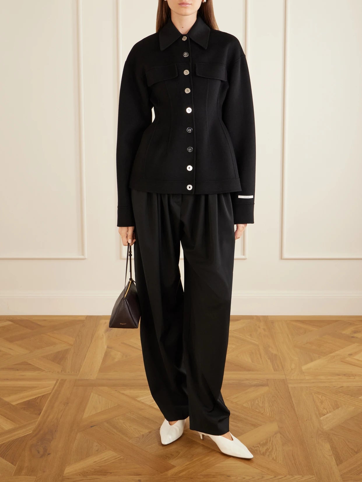 Image of a model wearing Pants. Product name - Zorro Wool Wide-leg Pants in Black colour by brand - Sportmax