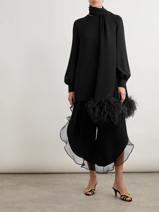 Image of a model wearing Tops. Product name - Feather-trimmed Scarf-detailed Silk Crepe De Chine Blouse in Black colour by brand - Valentino Garavani