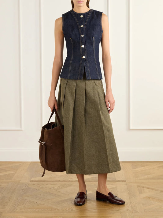 Image of a model wearing Outerwear. Product name - The Form Denim Vest in Dark denim colour by brand - FRAME