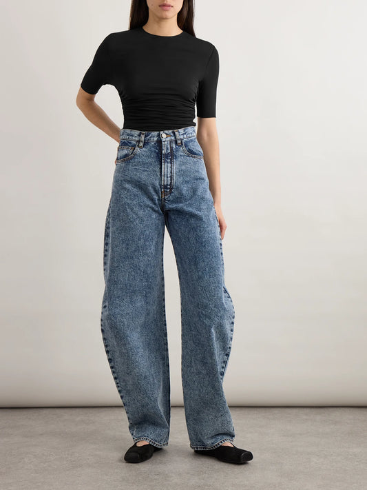 Image of a model wearing Tops. Product name - Ruched Stretch-jersey T-shirt in Black colour by brand - Alaïa