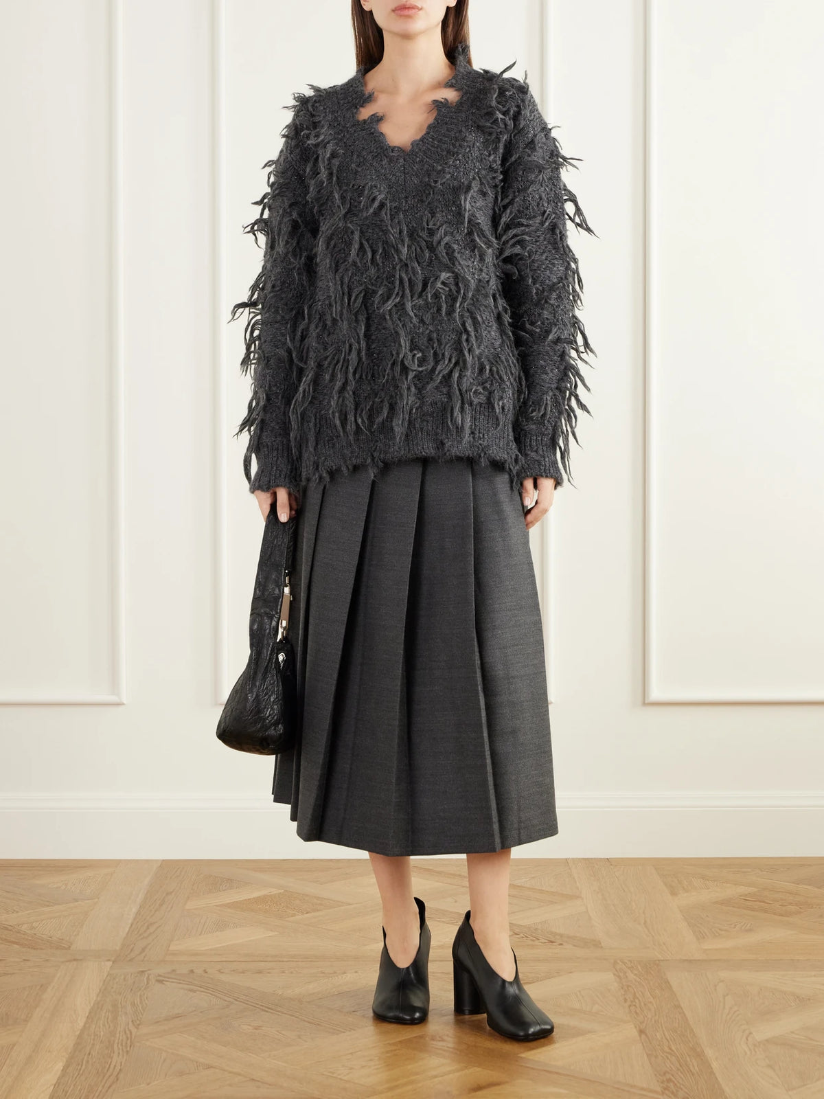 Image of a model wearing Outerwear. Product name - Distressed Wool-blend Sweater in Gray colour by brand - Junya Watanabe