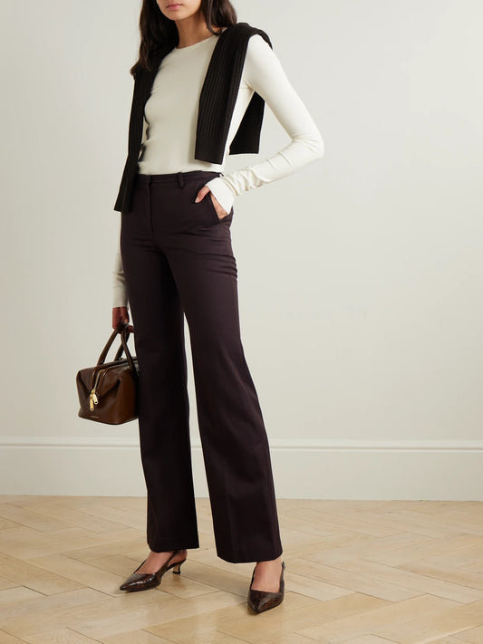 Image of a model wearing Tops. Product name - Ribbed Stretch Cotton And Modal-blend Top in Cream colour by brand - ÉTERNE