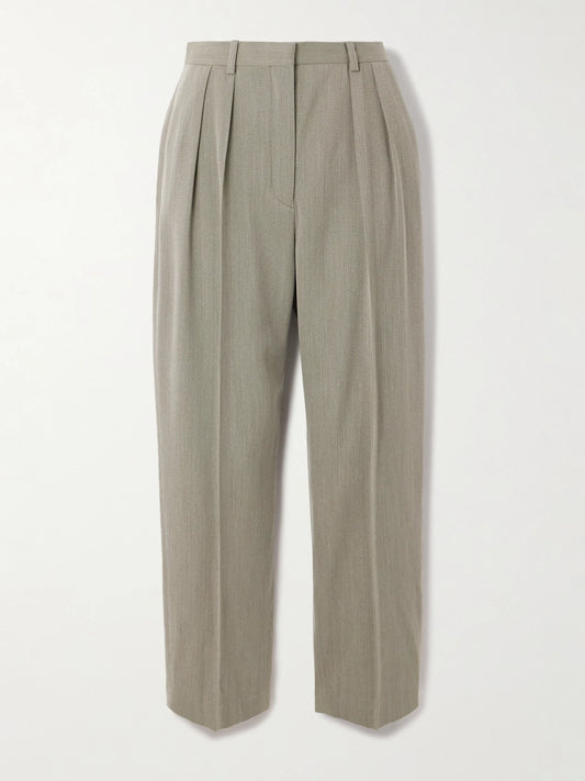 Image of a model wearing Pants. Product name - Hudson Cropped Pleated Wool Tapered Pants in Gray colour by brand - Loro Piana