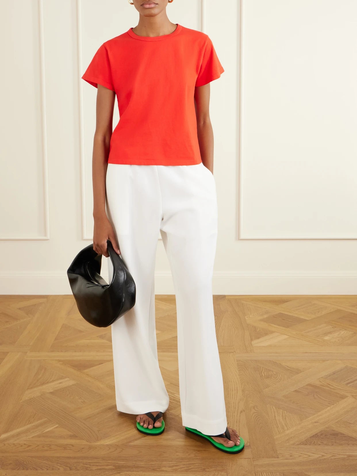 Image of a model wearing Tops. Product name - The Margo Cotton-jersey T-shirt in Red colour by brand - LESET