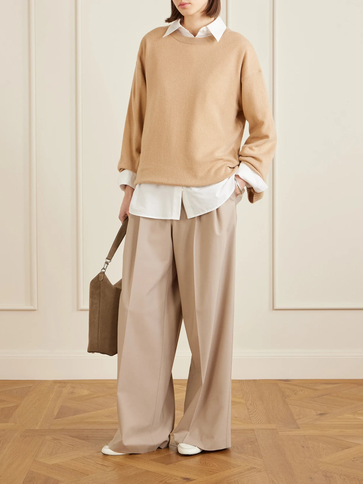 Image of a model wearing Outerwear. Product name - Cashmere Sweater in Camel colour by brand - Allude