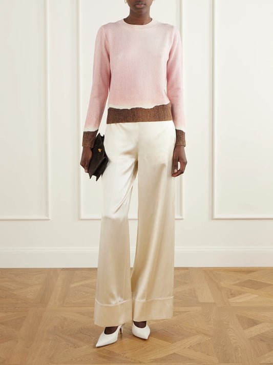 Image of a model wearing Outerwear. Product name - Wool Sweater in Pink colour by brand - Oscar de la Renta