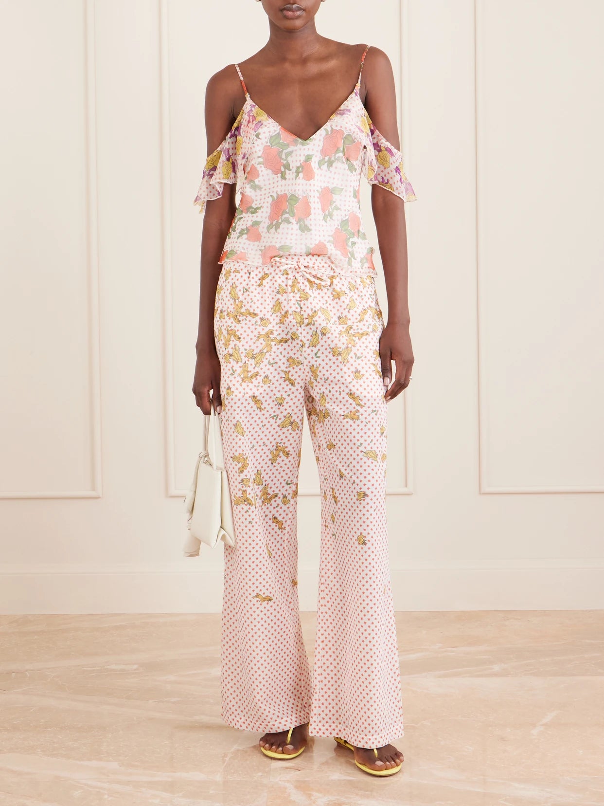Image of a model wearing Tops. Product name - Pajaritos Y Rosas Silk Tank in Blush colour by brand - Donde Esteban