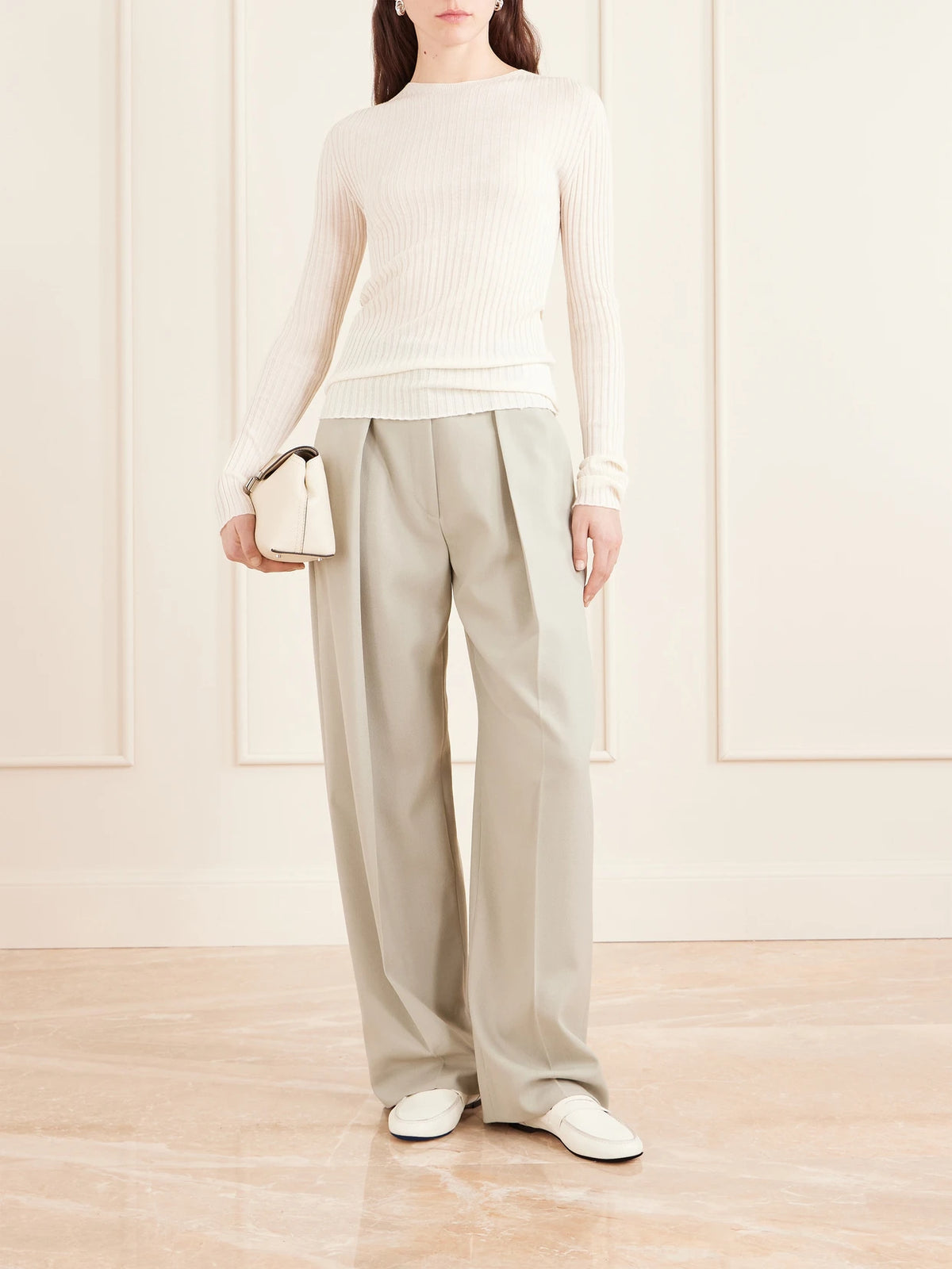 Image of a model wearing Outerwear. Product name - Fabi Ribbed Merino Wool Top in Ivory colour by brand - KALLMEYER