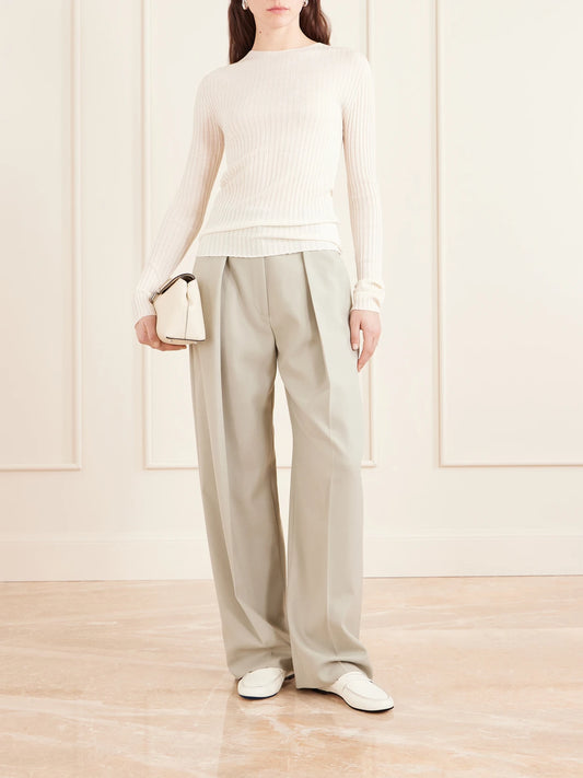 Image of a model wearing Outerwear. Product name - Fabi Ribbed Merino Wool Top in Ivory colour by brand - KALLMEYER