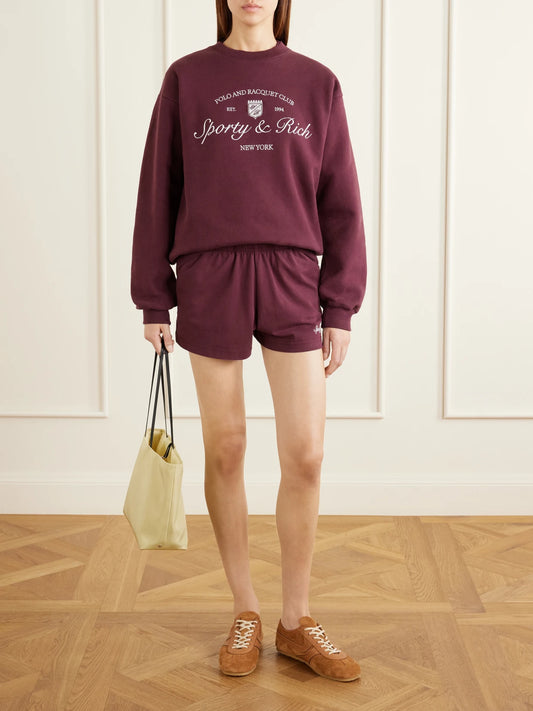 Image of Sleepwear & Loungewear. Product name - Syracuse Embroidered Cotton-jersey Sweater in Burgundy colour by brand - Sporty & Rich