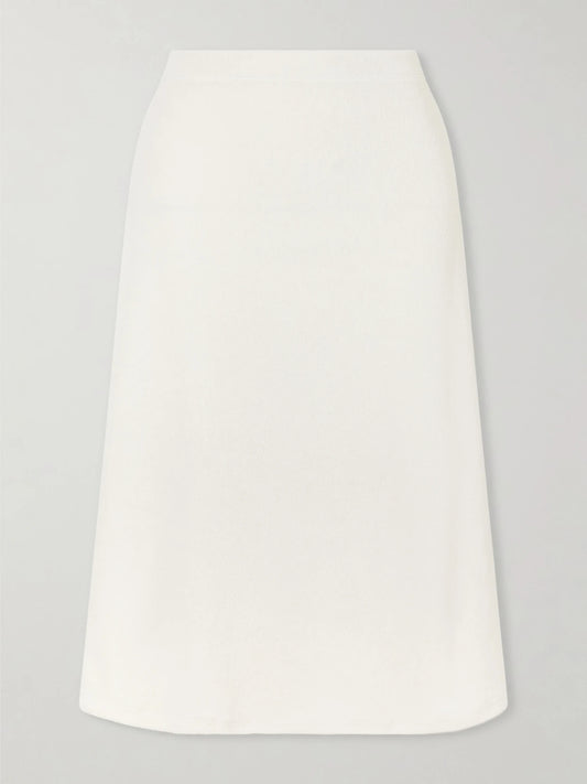 Image of a model wearing Skirts. Product name - Sienna Cotton-blend Terry Midi Skirt in Ivory colour by brand - Suzie Kondi