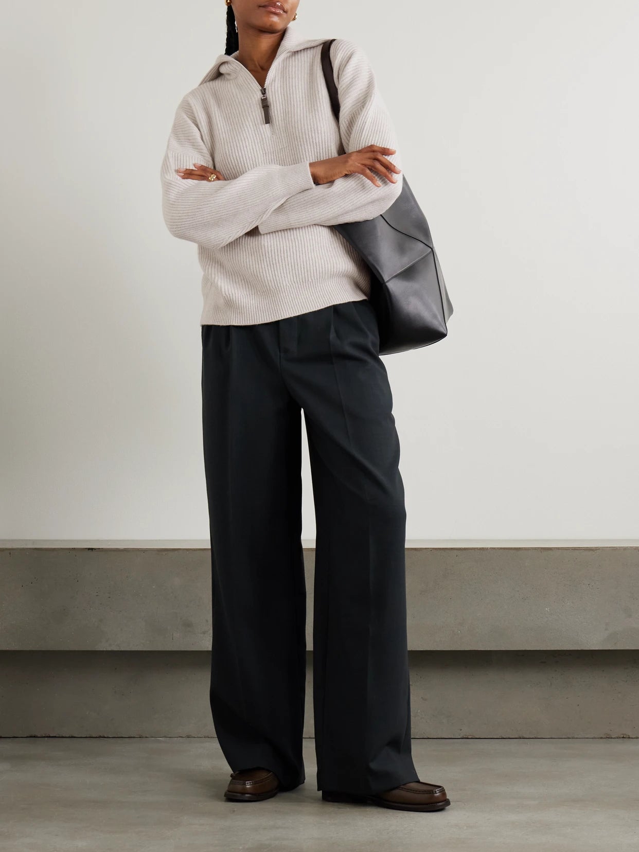 Image of a model wearing Outerwear. Product name - Bead-embellished Ribbed Cashmere Half-zip Sweater in Beige colour by brand - Brunello Cucinelli