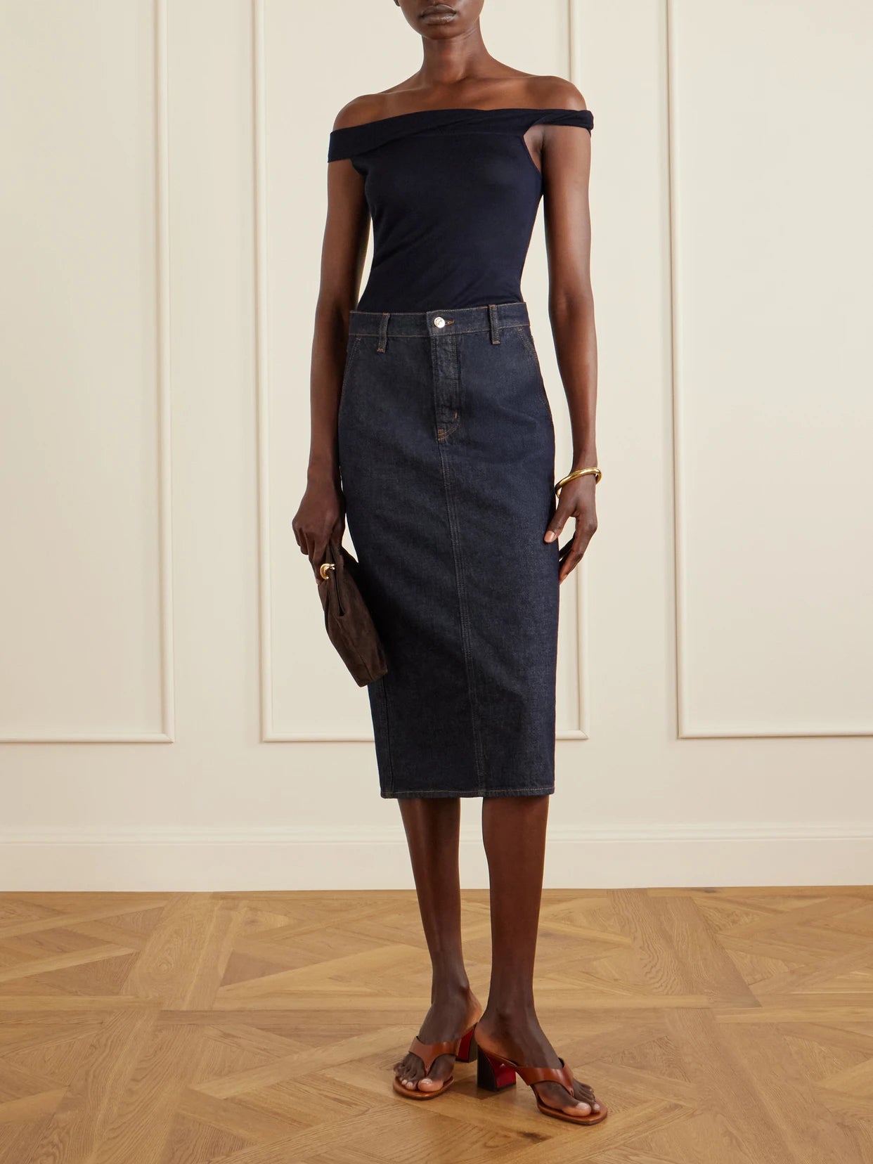 Image of a model wearing Tops. Product name - Off-the-shoulder Silk And Cashmere-blend Top in Navy colour by brand - Arch4