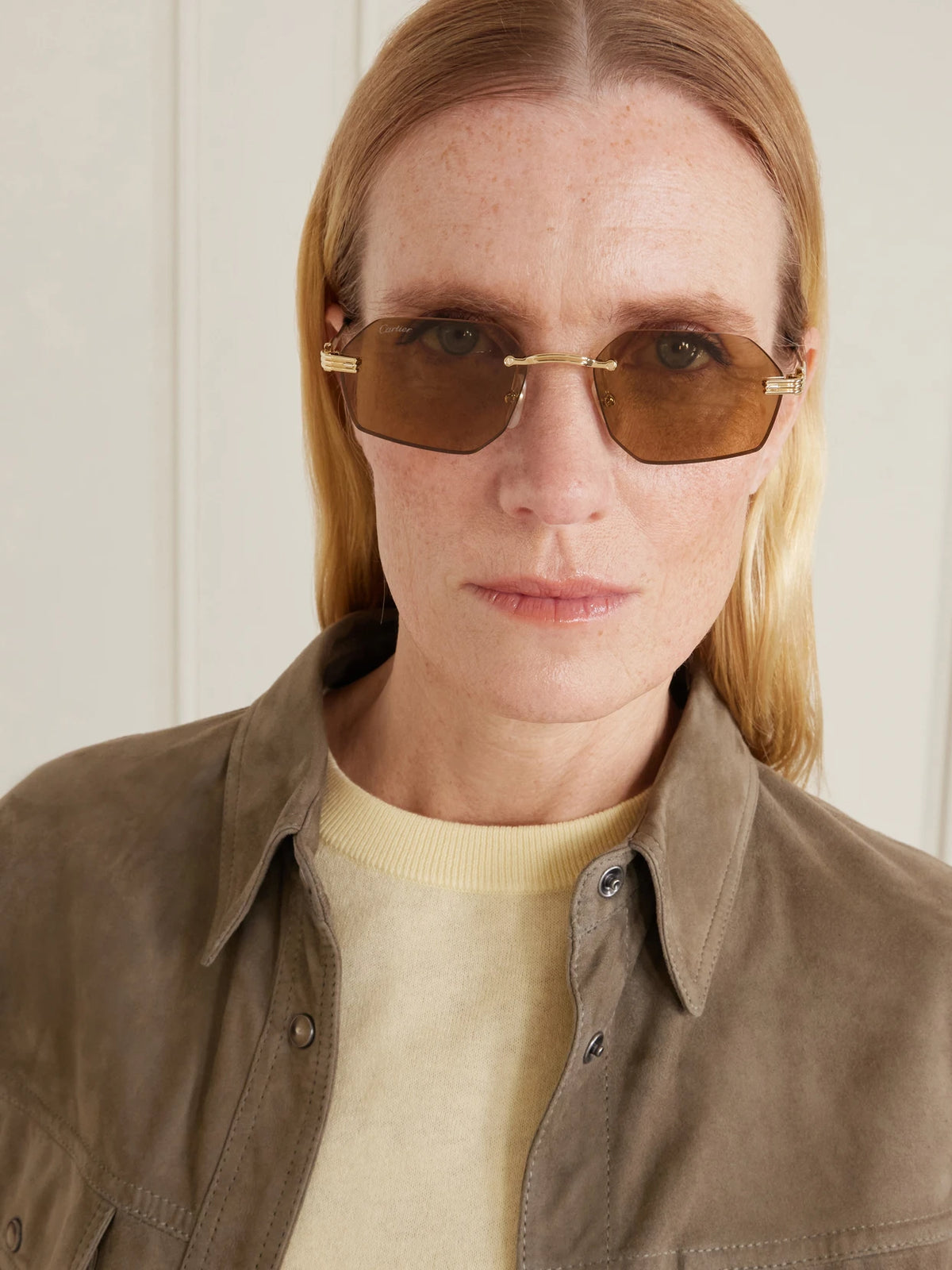 Image of Sunglasses. Product name - Rounded-frame Metal Sunglasses in Brown colour by brand - Cartier Eyewear