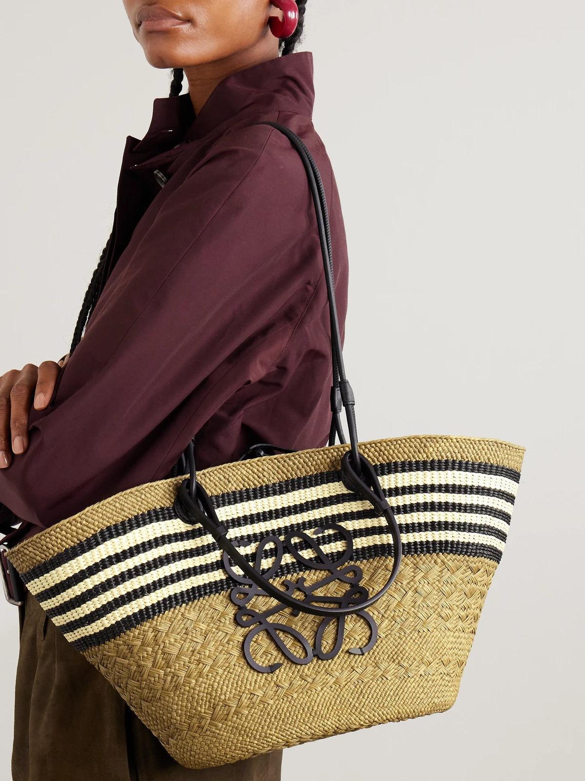 Image of Bags. Product name - + Paula's Ibiza Anagram Basket Medium Leather-trimmed Striped Raffia Tote in Army green colour by brand - LOEWE