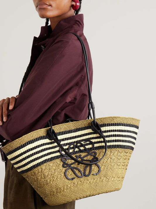 Image of Bags. Product name - + Paula's Ibiza Anagram Basket Medium Leather-trimmed Striped Raffia Tote in Army green colour by brand - LOEWE