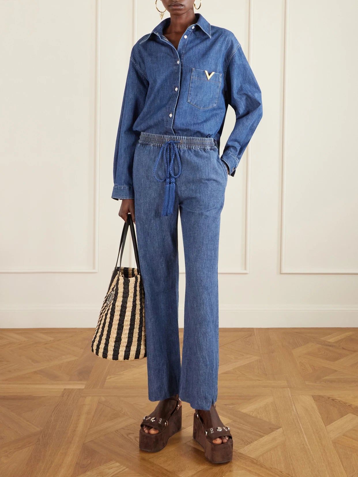 Image of Jeans. Product name - Tasseled High-rise Bootcut Jeans in Dark denim colour by brand - Valentino Garavani