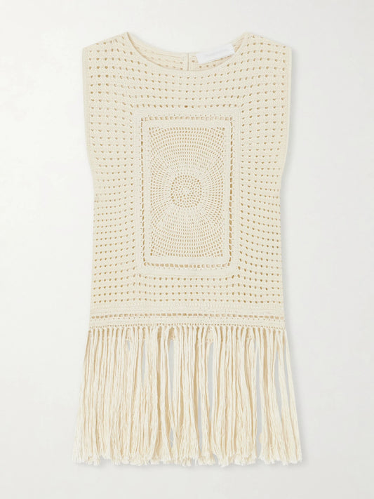 Image of a model wearing Tops. Product name - Indra Fringed Crocheted Cotton Tank Top in Cream colour by brand - Zimmermann