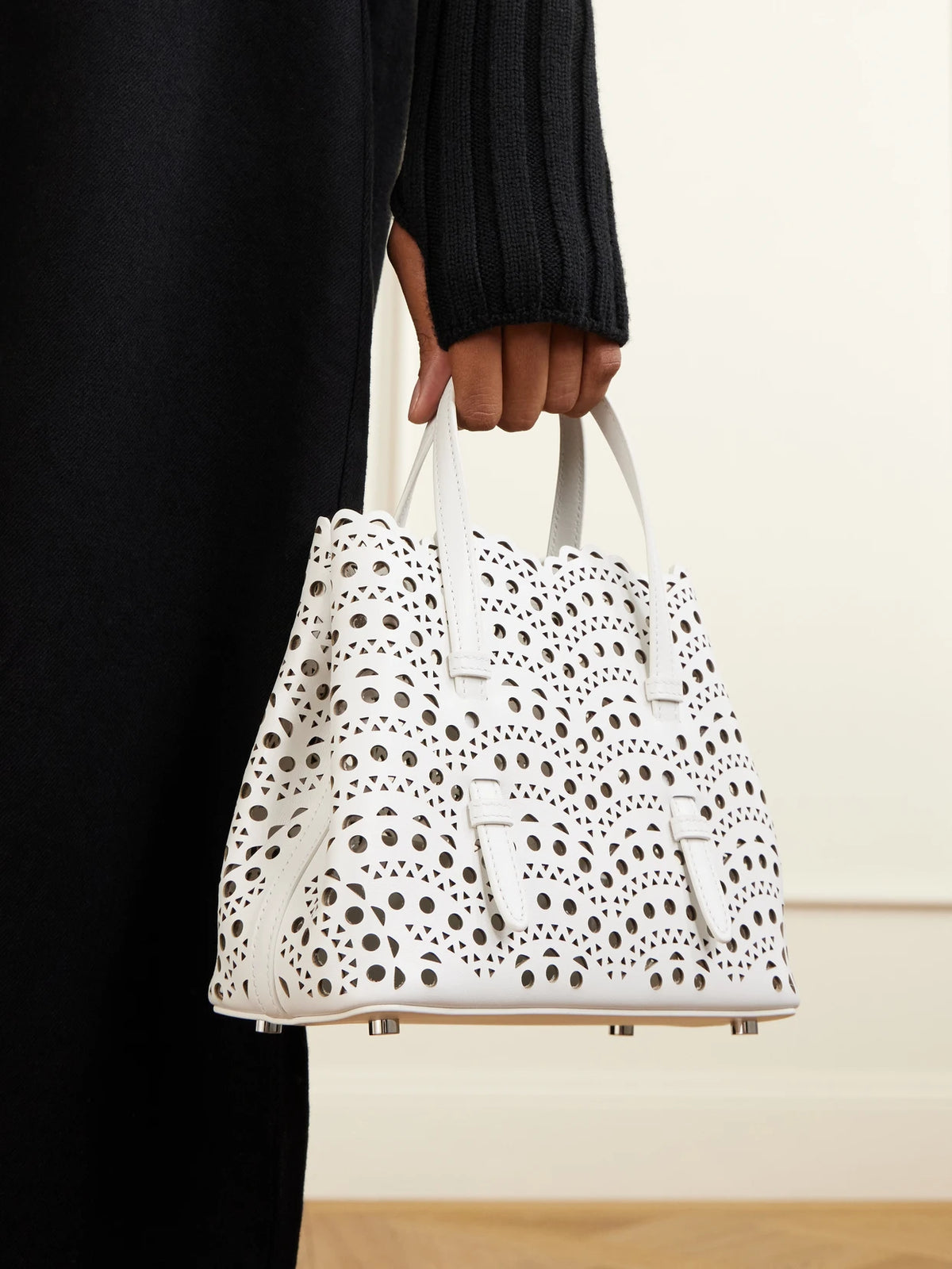 Image of Bags. Product name - Mina 20 Laser-cut Leather Tote in Off-white colour by brand - Alaïa