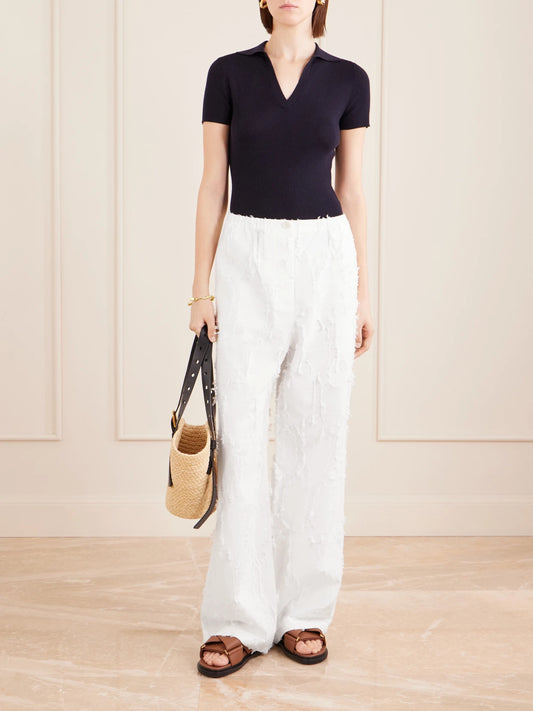 Image of a model wearing Pants. Product name - Shilo Jacquard-knit Cotton-blend Straight-leg Pants in Off-white colour by brand - Proenza Schouler White Label