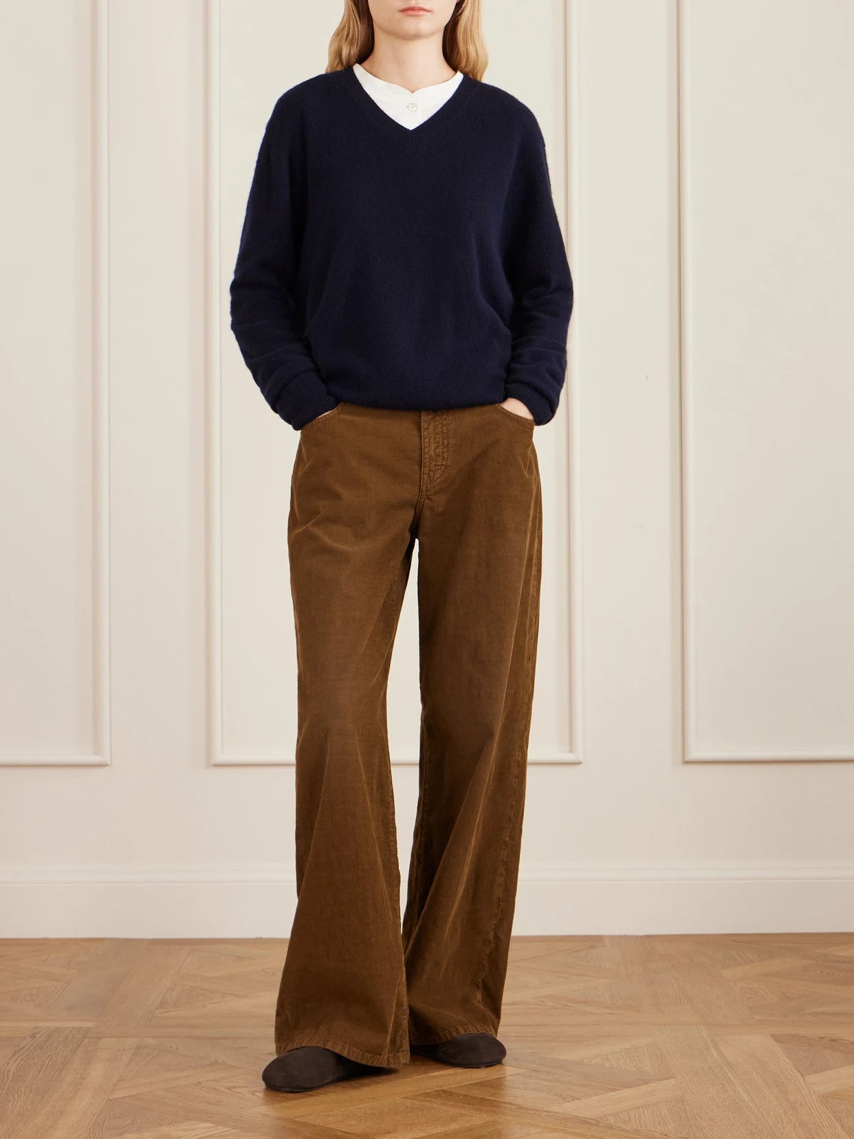 Image of a model wearing Outerwear. Product name - Numi Cashmere Sweater in Navy colour by brand - The Row