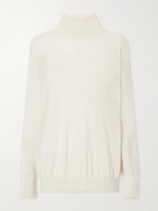 Image of a model wearing Outerwear. Product name - Orly Cashmere And Silk-blend Turtleneck in Ivory colour by brand - The Row