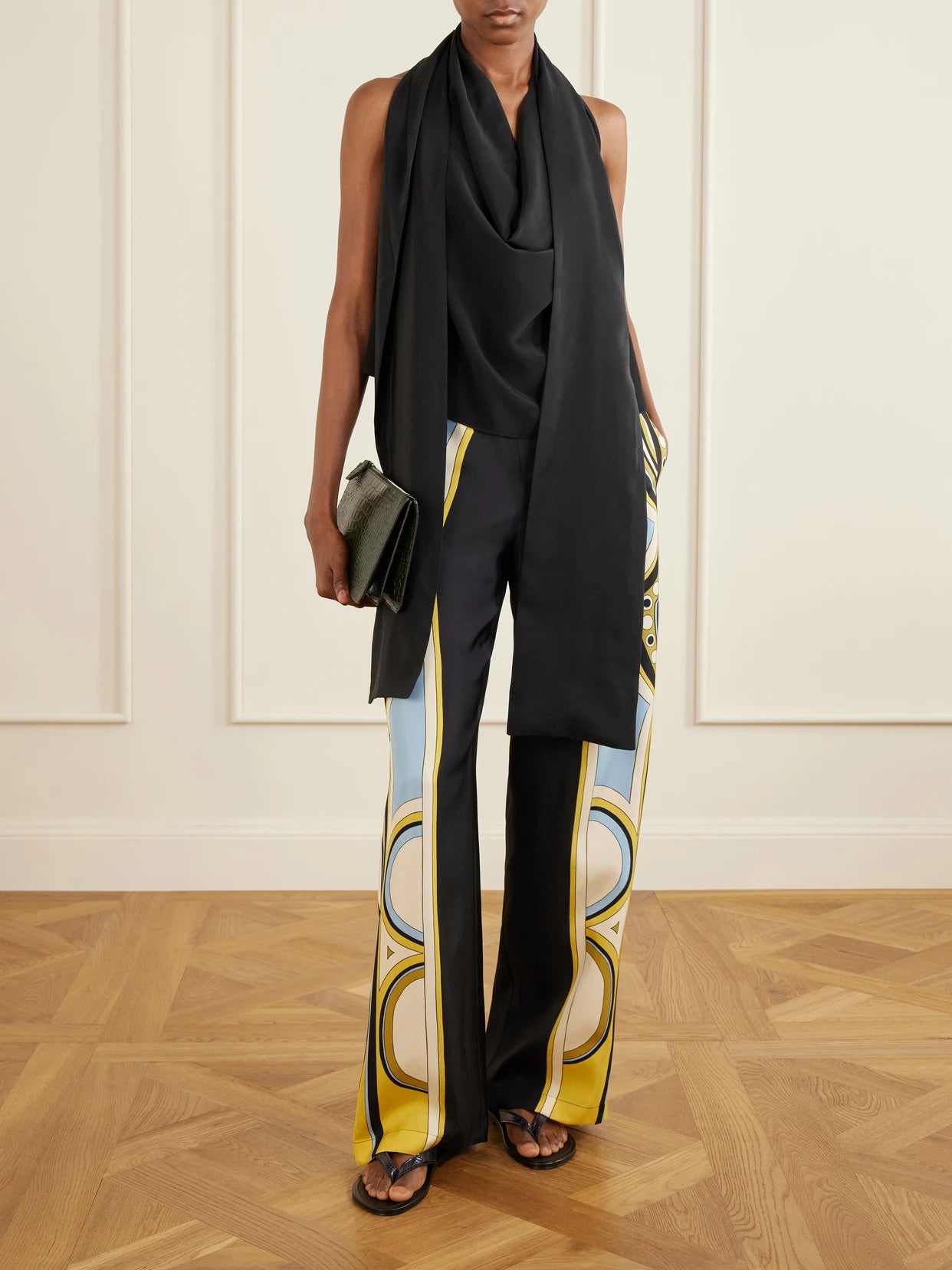 Image of a model wearing Pants. Product name - Club Printed Silk-twill Wide-leg Pants in Black colour by brand - La DoubleJ