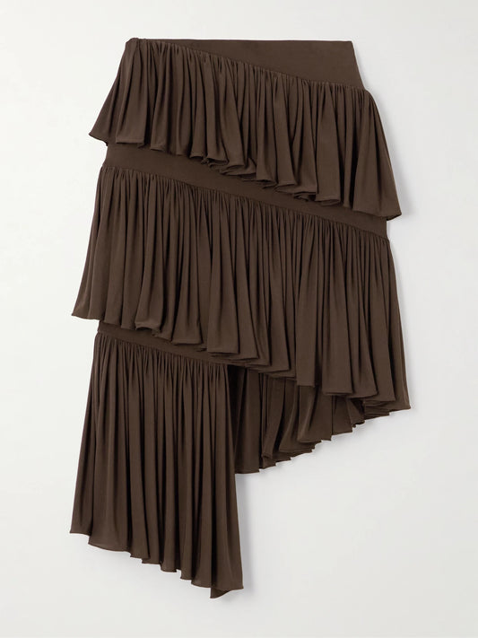 Image of a model wearing Skirts. Product name - Tiered Asymmetric Jersey Mini Skirt in Brown colour by brand - Alaïa