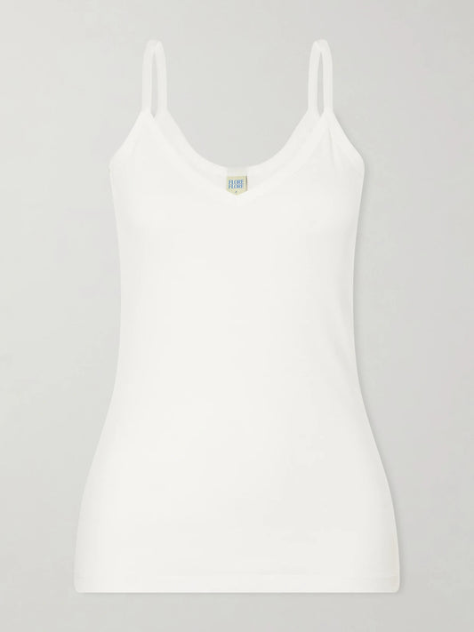 Image of a model wearing Tops. Product name - Isla Organic Cotton-jersey Camisole in White colour by brand - FLORE FLORE
