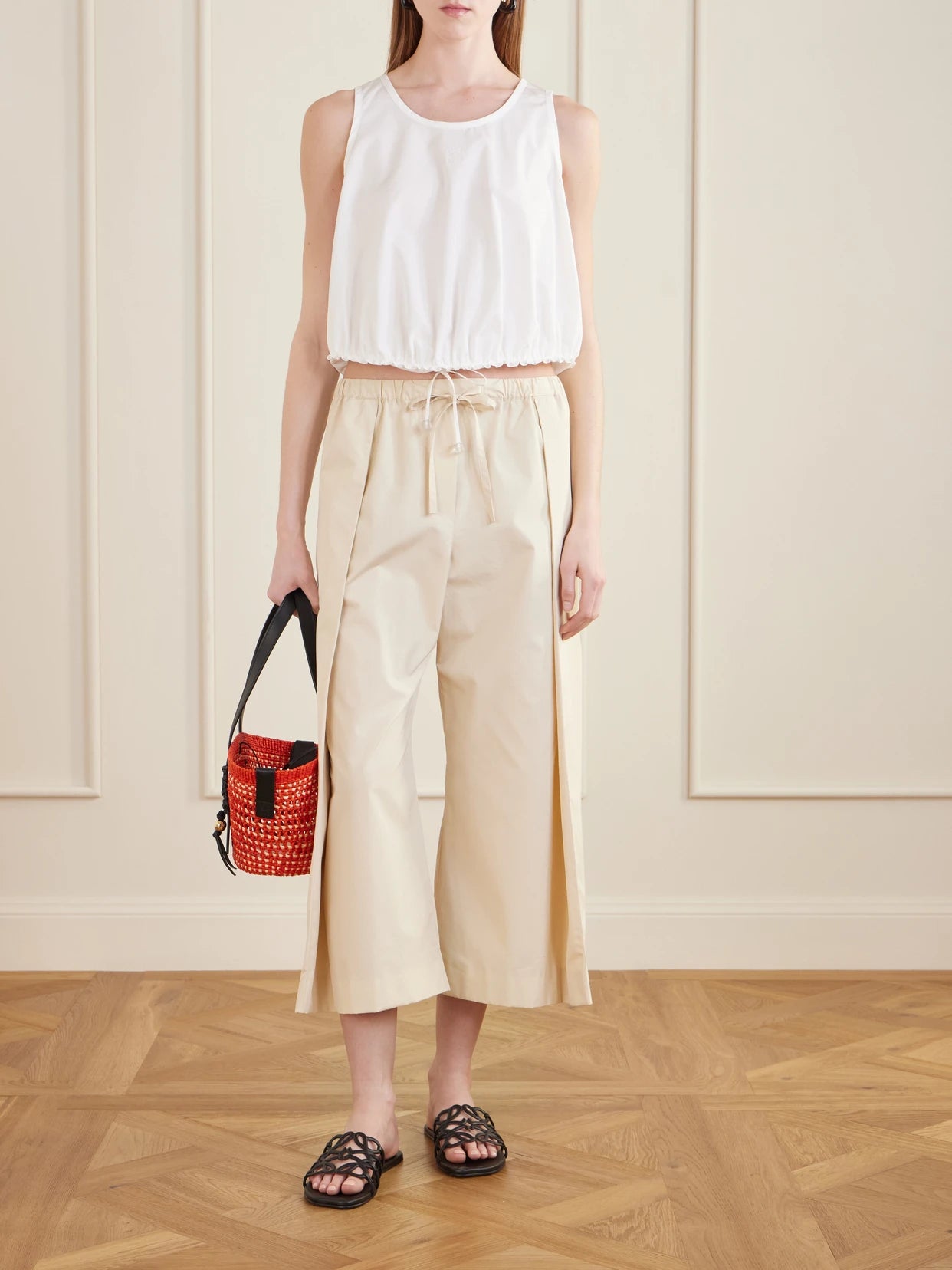 Image of a model wearing Tops. Product name - + Paula's Ibiza Anagram Appliquéd Cotton-popeline Top in White colour by brand - LOEWE
