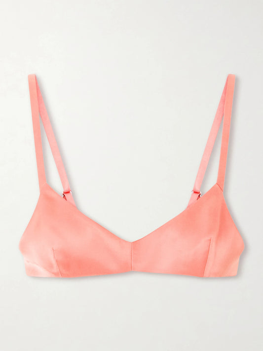 Image of a model wearing Tops. Product name - Talita Satin Bralette in Pink colour by brand - KHAITE