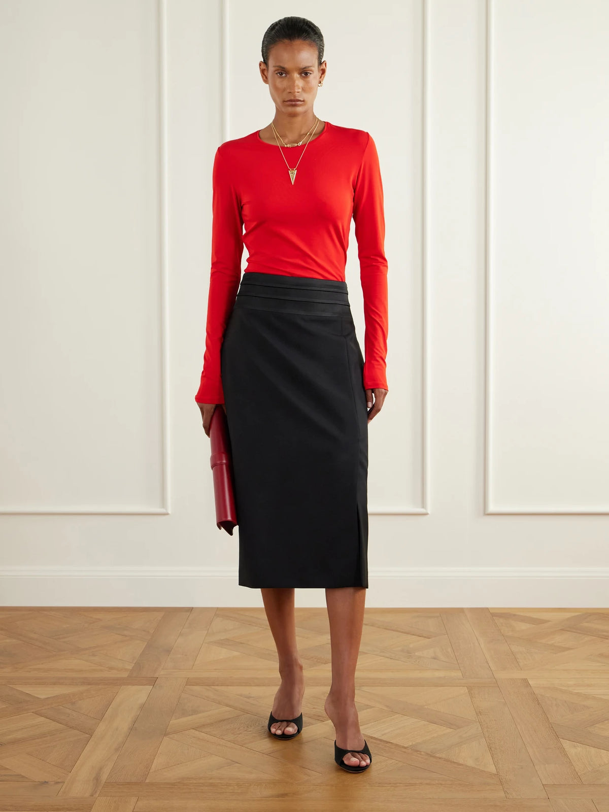 Image of a model wearing Skirts. Product name - Claris Satin-trimmed Wool-blend Gabardine Midi Skirt in Black colour by brand - RÓHE