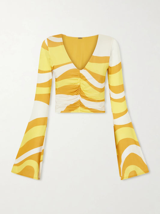 Image of a model wearing Tops. Product name - Aelin Ruched Printed Jersey Top in Yellow colour by brand - Cala de la Cruz