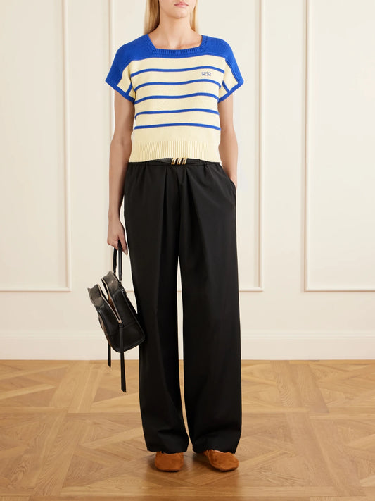 Image of a model wearing Outerwear. Product name - Anagram-embroidered Striped Cotton And Wool-blend Sweater in Yellow colour by brand - LOEWE