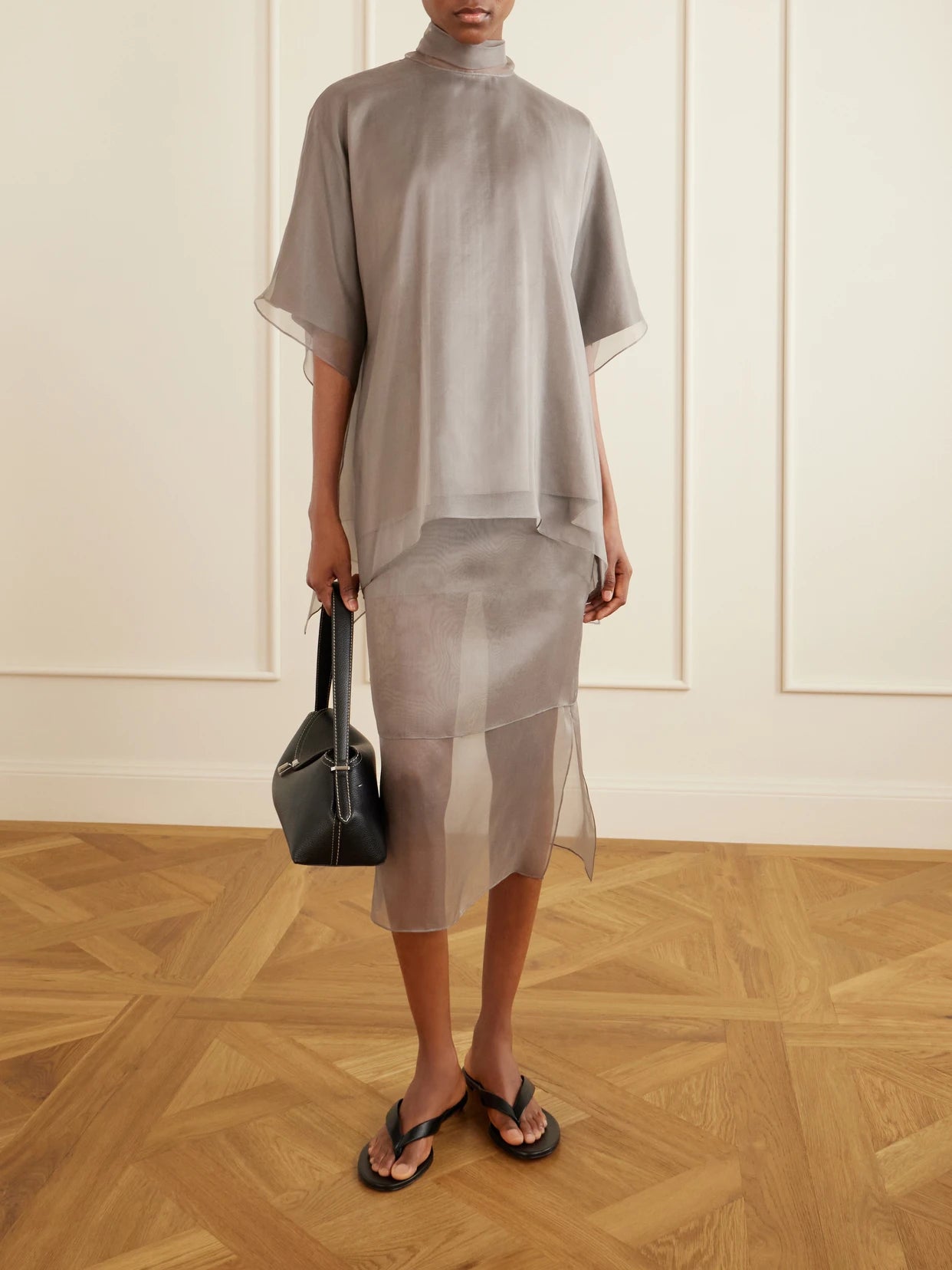 Image of a model wearing Skirts. Product name - The Brett Silk-organza Midi Skirt in Gray colour by brand - Brandon Maxwell