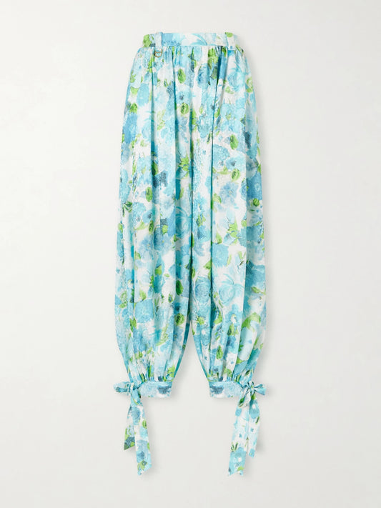 Image of a model wearing Pants. Product name - Floral-print Silk-jacquard Balloon Pants in Blue colour by brand - Chloé