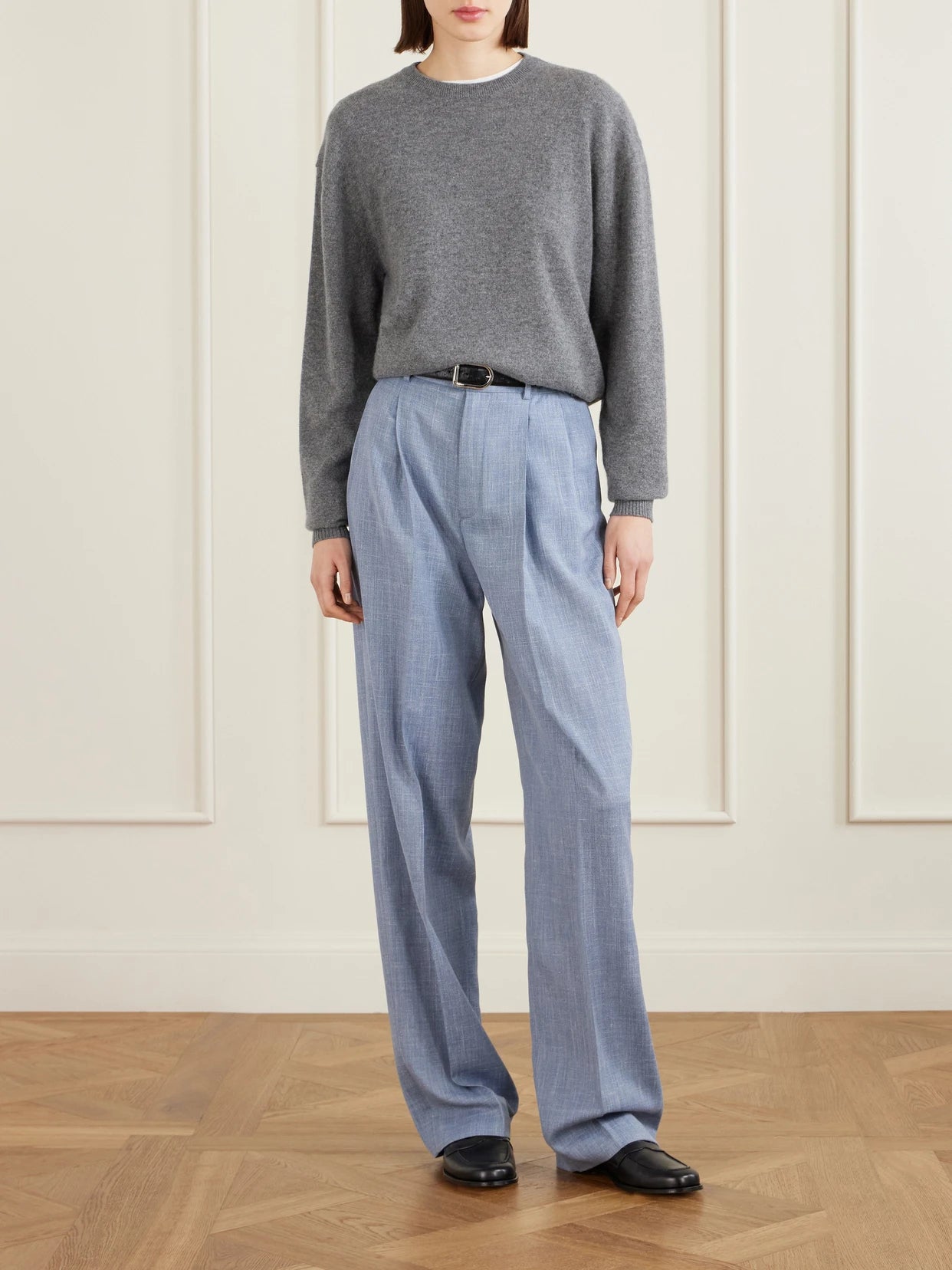 Image of a model wearing Pants. Product name - Hector Pleated Wool, Silk And Linen-blend Wide-leg Pants in Light blue colour by brand - Loro Piana