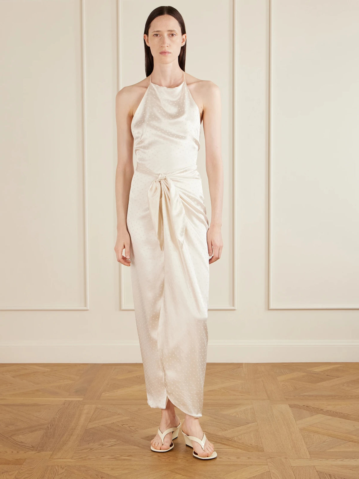 Image of Dresses. Product name - Nourin Polka-dot Knotted Satin-jacquard Halterneck Maxi Dress in White colour by brand - AFLALO