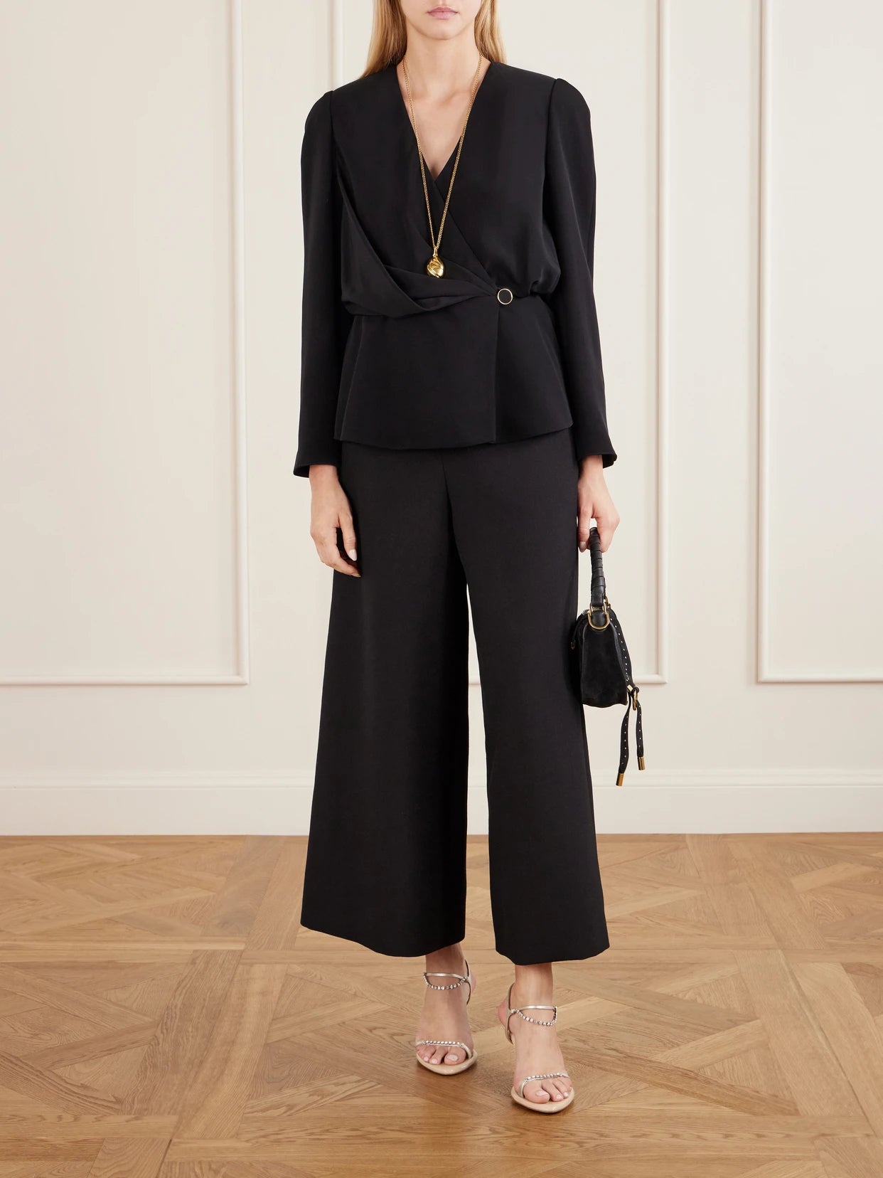 Image of a model wearing Tops. Product name - Gathered Faille Blouse in Black colour by brand - Chloé