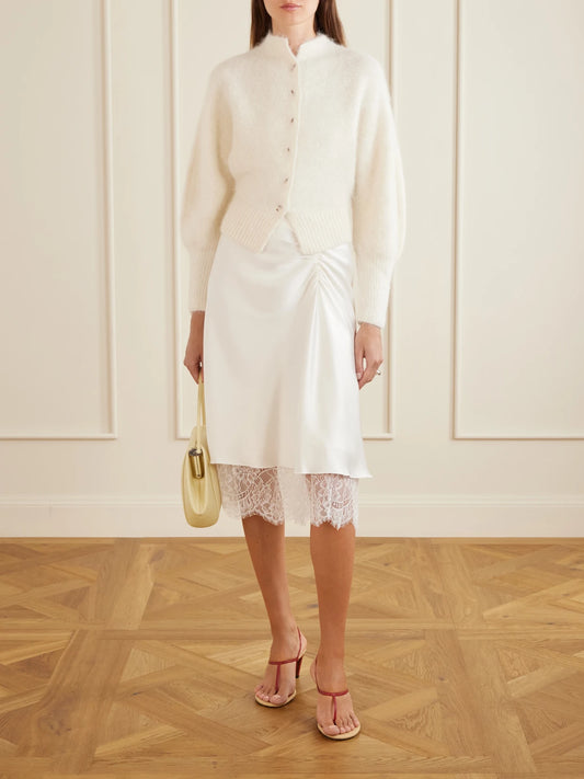 Image of a model wearing Outerwear. Product name - Lise Wool-blend Cardigan in Ivory colour by brand - SIR.