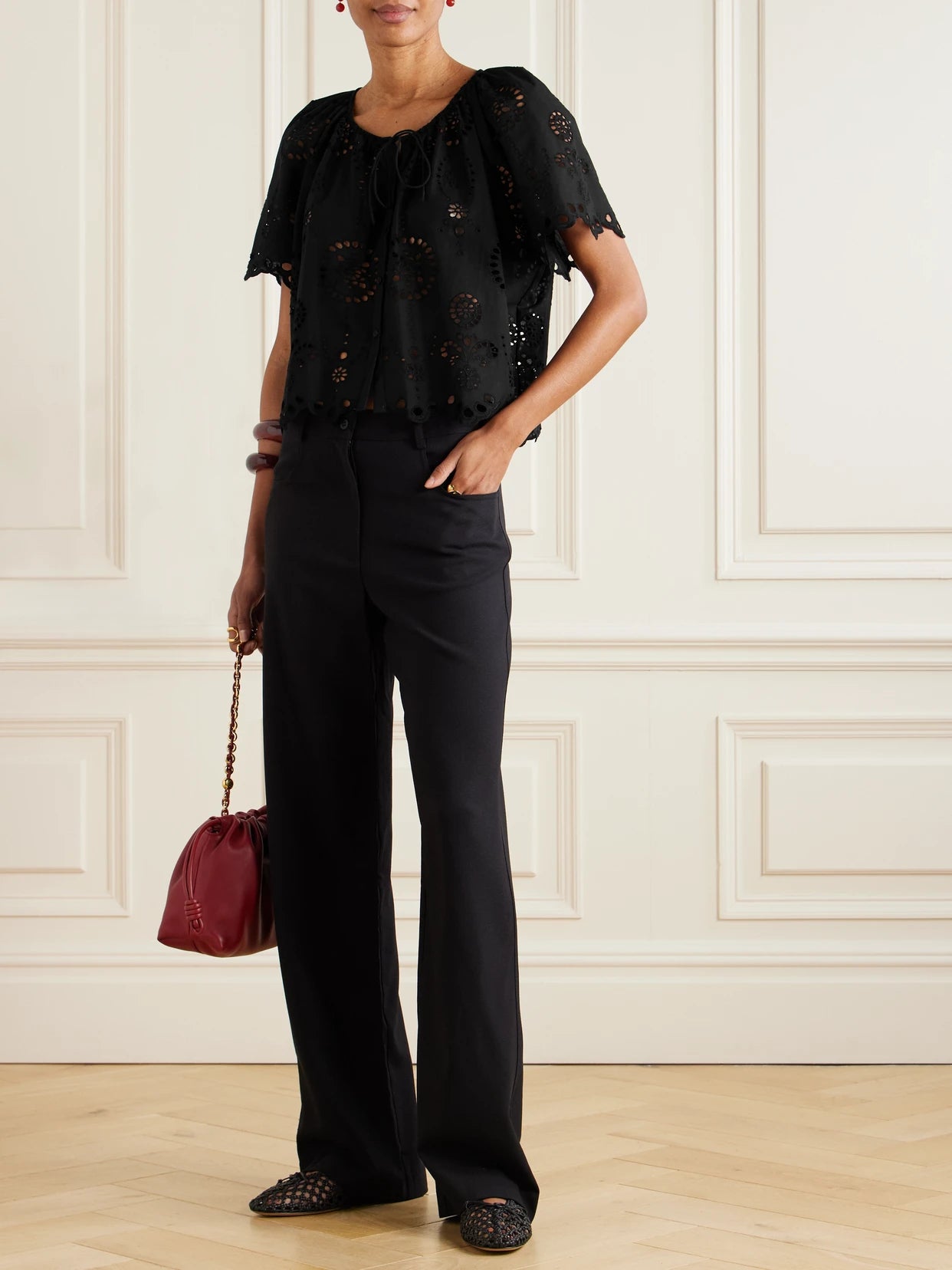Image of a model wearing Tops. Product name - Scalloped Broderie Anglaise Cotton-poplin Shirt in Black colour by brand - Matteau